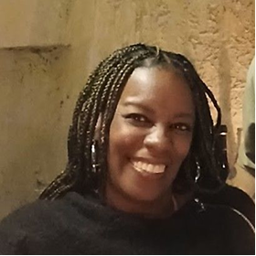 A image of a concrete sphere, balanced between two other larger spheres