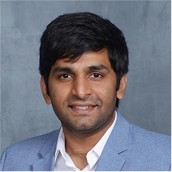 A image of a concrete sphere, balanced between two other larger spheres